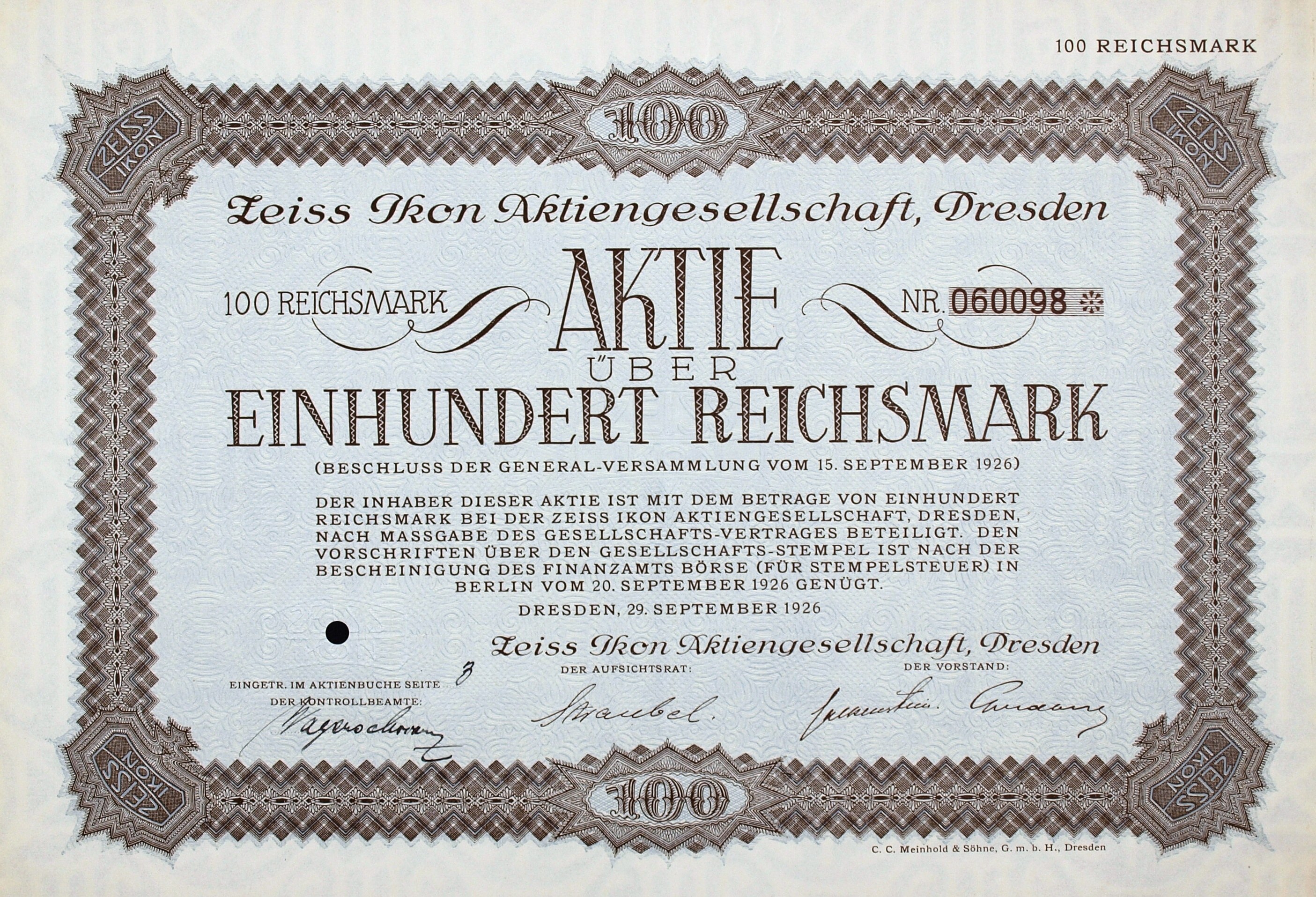 Alte deutsche Aktie über 100 Reichsmärker mit schwarzem Rand und deutscher Beschriftung.