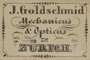 Eine alte Visitenkarte mit der Aufschrift "J. Goldschmidt Mechanicus & Optics in Zürich" aus dem frühen 20. Jahrhundert.