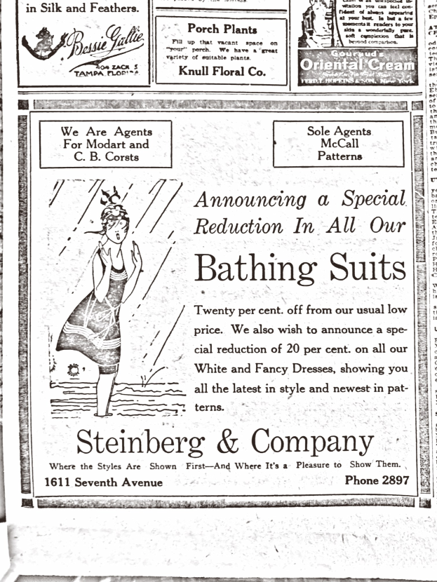 Eine Frau in einem weißen Rollkragenpullover und langärmeligen Kleid mit einem Dutt, die in der Mitte einer Werbung für Steinberg & Company's Badesachen steht, umgeben von Text.